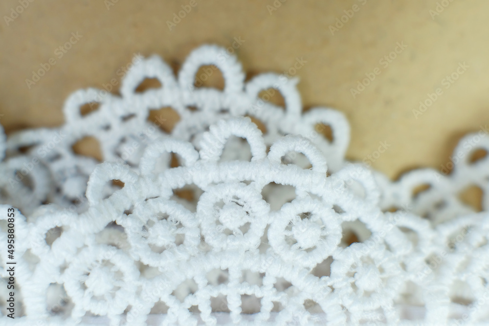 White brocade background, White Prayer hijab brocade detail. Beautiful fabric with fashionable motifs White brocade background, White Prayer hijab brocade detail. Beautiful fabric with fashionable motifs
