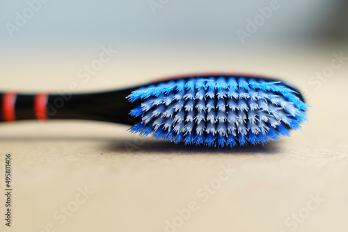 Close up of blue toothbrush on the table