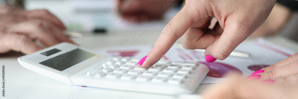 Female accountant busy with counting Female accountant busy with counting