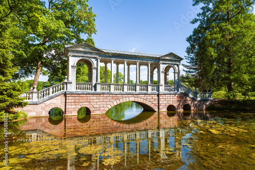 View of the Marble (Palladian) bridge on a sunny summer day in Ekaterininsky Park. Tsarskoye Selo, Pushkin, St. Petersburg. Russia