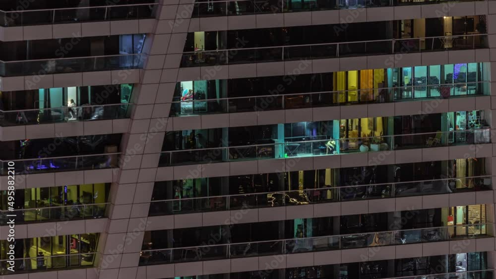 Night view of glowing windows in apartment tower timelapse. Night view of glowing windows in apartment tower timelapse.