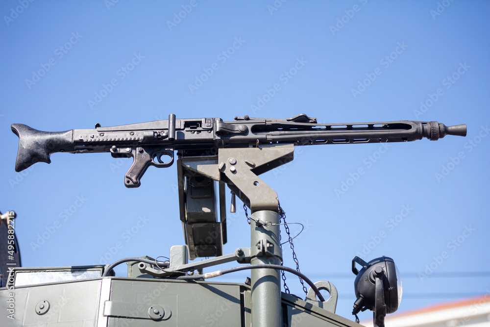Machine Gun turret on an Armored Personnel Carrier. War heavy weapon, army equipment, blue sky. Machine Gun turret on an Armored Personnel Carrier. War heavy weapon, army equipment, blue sky.