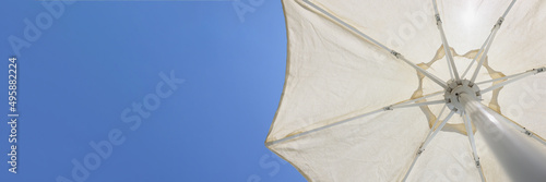 Sun rays fall on parasol photo