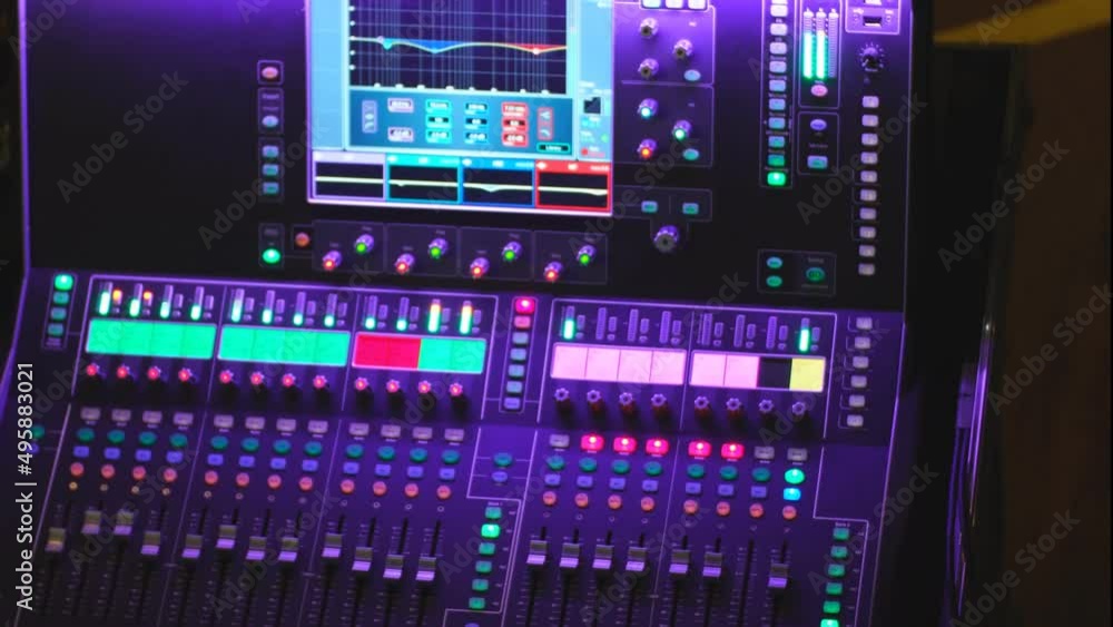 Modern digital mixing console with faders, control buttons and touch ...