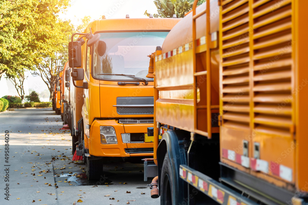 Street sweepers are cleaning city street