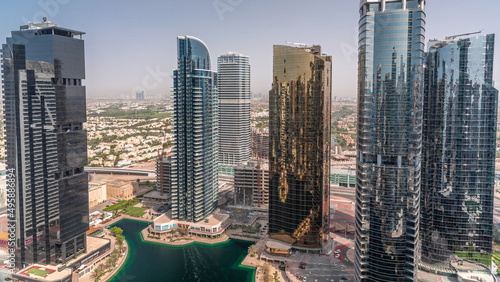 Tall residential buildings at JLT aerial timelapse, part of the Dubai multi commodities centre mixed-use district. photo
