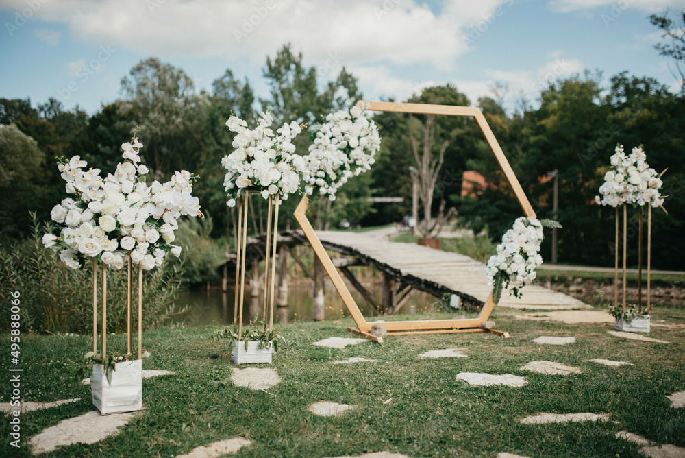 Fototapeta premium Decoration for party. Tables set for an event party or wedding reception. Luxury elegant table setting dinner in a restaurant. Glasses and dishes.