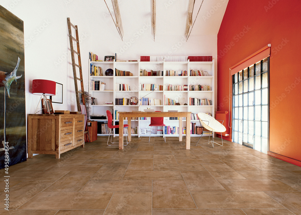 Fototapeta premium Modern interior design, room with beige tiles, red wall, seamless table, luxurious background.