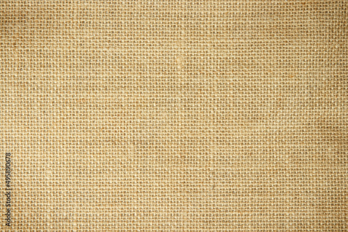 Jute hessian sackcloth burlap canvas woven texture background pattern in light beige cream brown color blank.