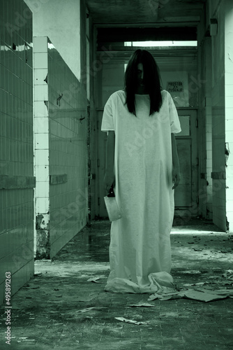 Horror scene of a scary woman in derelict abandoned building