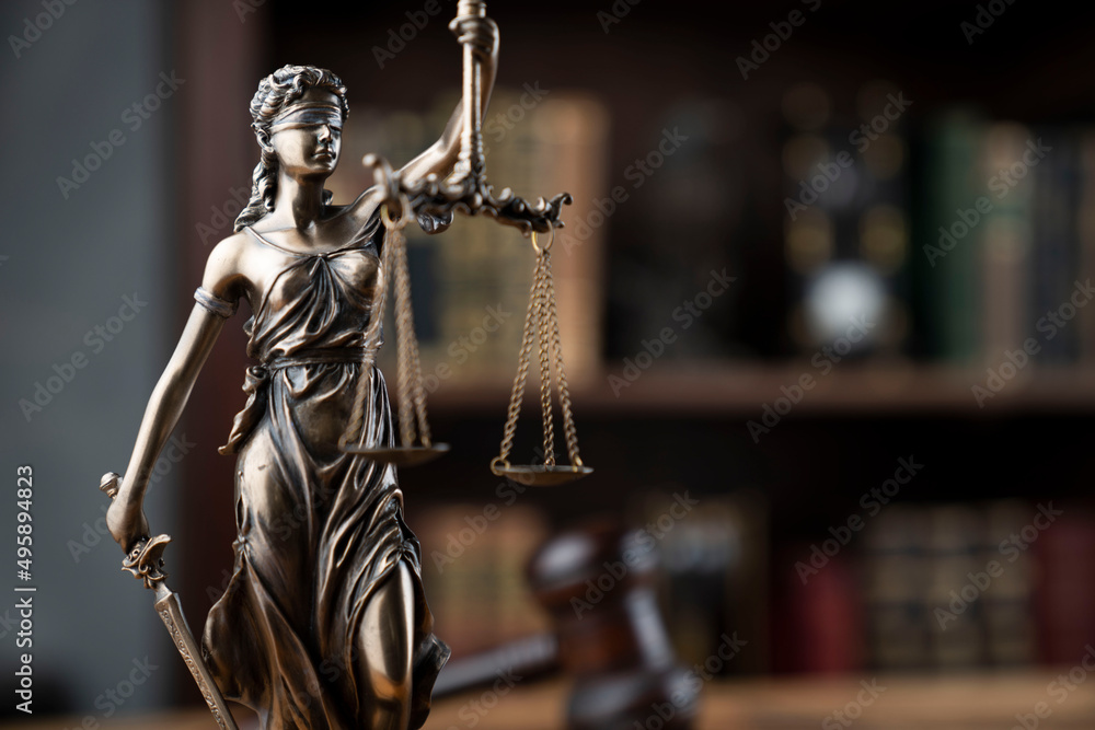 Lawyer office. Law symbols composition: judge’s gavel, Themis sculpture and legal books. Lawyer office. Law symbols composition: judge’s gavel, Themis sculpture and legal books.