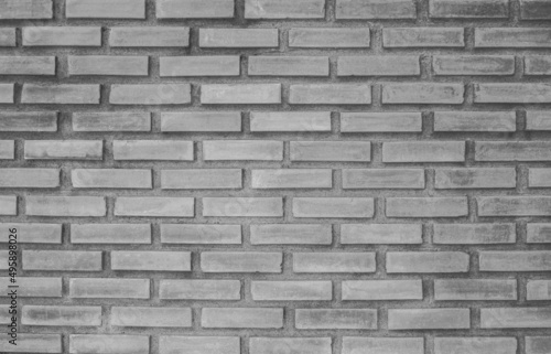 Wide old gray brick wall backdrop for home or office design.