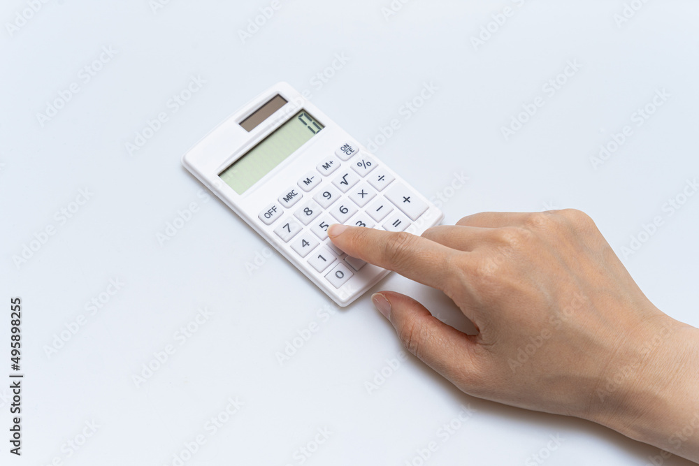Concept of using calculator on white background Concept of using calculator on white background