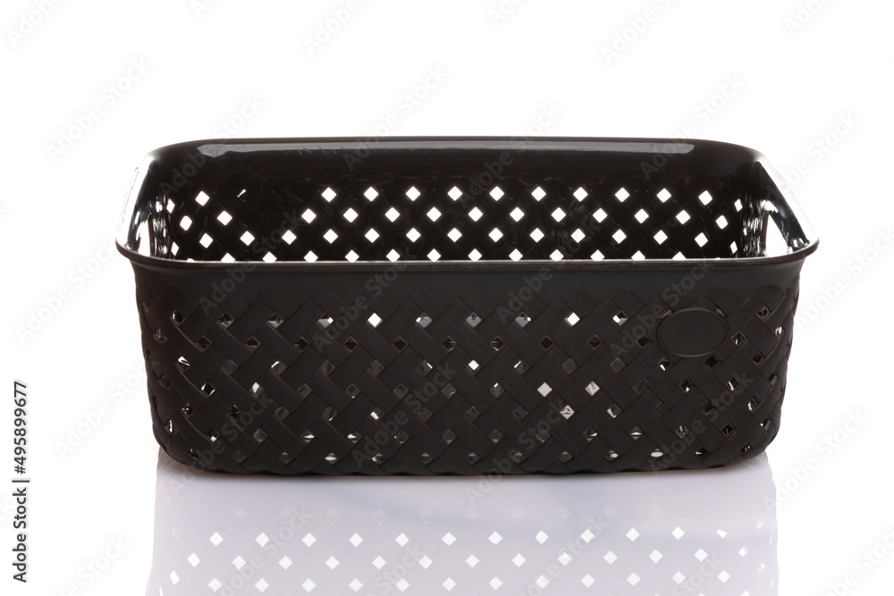 black plastic container with slots on a white isolated background black plastic container with slots on a white isolated background