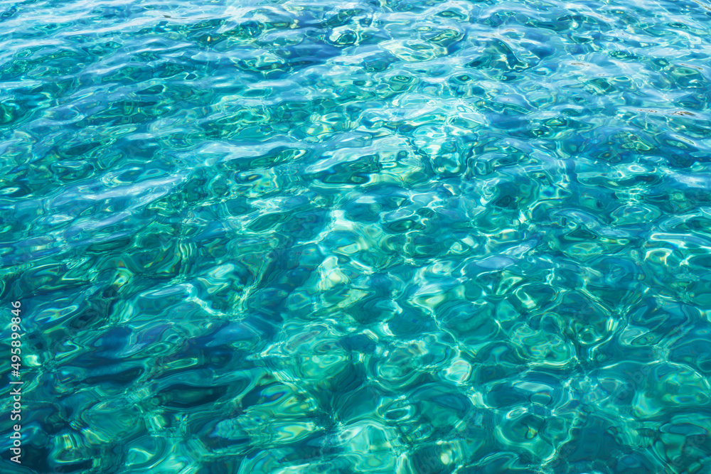 Transparent turquoise sea water, natural marine background.