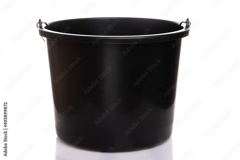 Black construction plastic bucket with a metal handle on a white isolated background Black construction plastic bucket with a metal handle on a white isolated background