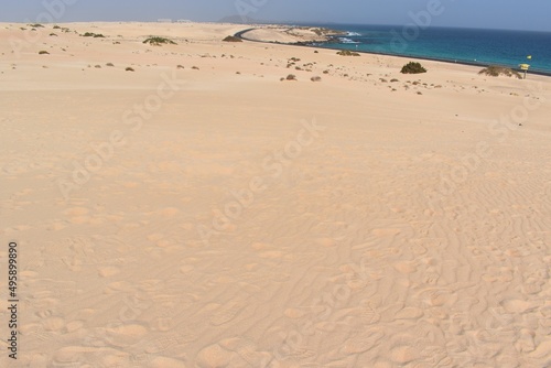 Dunes, a road, and the sea in the coast of Fuerteventura © Cande Marrero