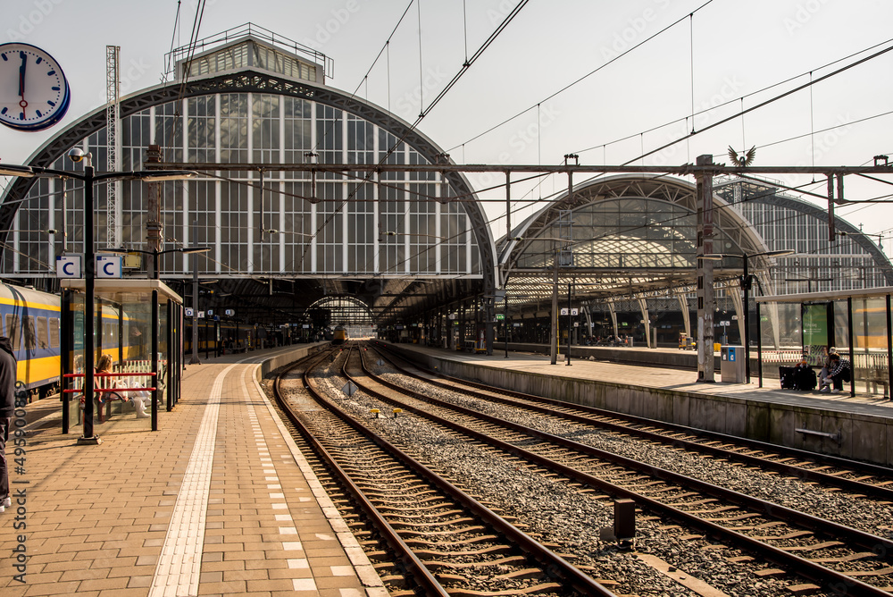 Amsterdam, Netherlands, march 2022. Dutch train in the landscape and in the central station