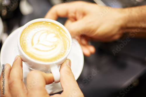 person holding a cup of coffee