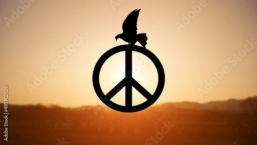 A bird perched on a symbol of freedom in the sky during the naturally.