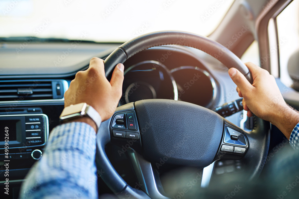 Always on the go. Cropped shot of an unidentifiable man driving a car. Always on the go. Cropped shot of an unidentifiable man driving a car.