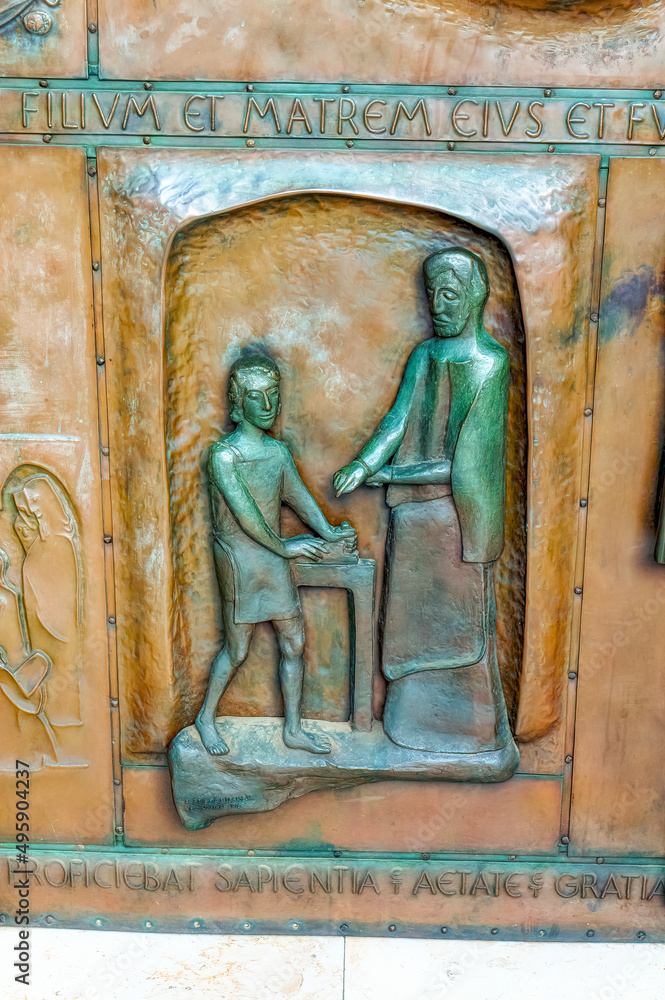 Motives from the Holy Bible depicted at the bronze door of  the Church of the Annunciation in Nazareth, Israel.