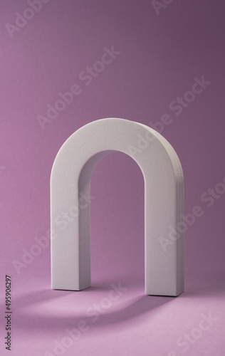 Vertical shot of White letter N object on purple background with copy space