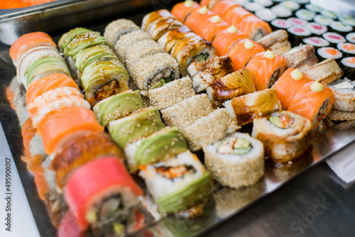 set of rolls set sushi with avocado shrimp salmon and eel