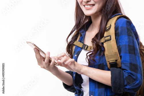 Attractive beautiful travel woman with backpack using mobile to search for tourist attractions isolated on white background. Beautiful young asian woman travel concept.