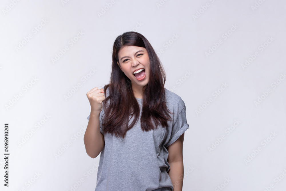 Image of feeling excited, shock, surprise and happy. Young asian woman standing on white background. Female face expressions and emotions body language concept. Image of feeling excited, shock, surprise and happy. Young asian woman standing on white background. Female face expressions and emotions body language concept.