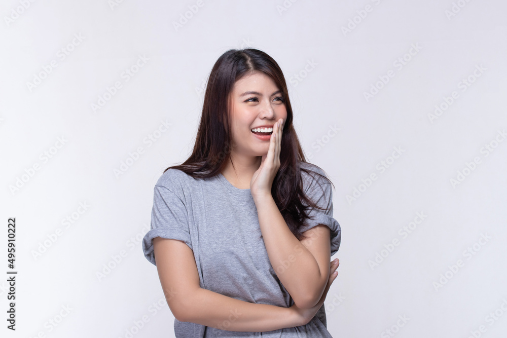 Image of feeling smile and happy. Cheerful young asian woman with brunette long hair in casual shirt smiling with teeth on white. Female face expressions and emotions concept. Image of feeling smile and happy. Cheerful young asian woman with brunette long hair in casual shirt smiling with teeth on white. Female face expressions and emotions concept.
