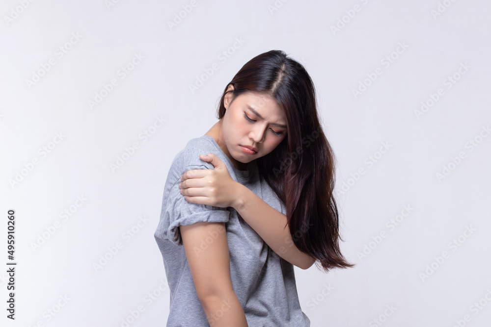 Beautiful young woman feeling face that expression pain holding neck and shoulder. Health care and medical concept. Beautiful young woman feeling face that expression pain holding neck and shoulder. Health care and medical concept.