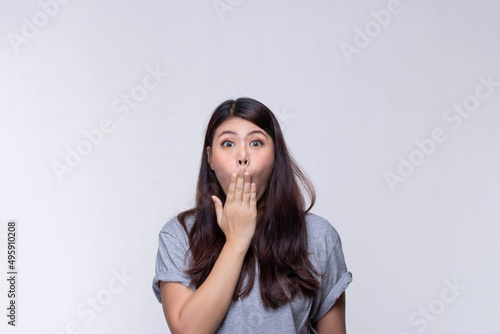 Image of feeling excited, shock, surprise and happy. Young asian woman standing on white background. Female face expressions and emotions body language concept.