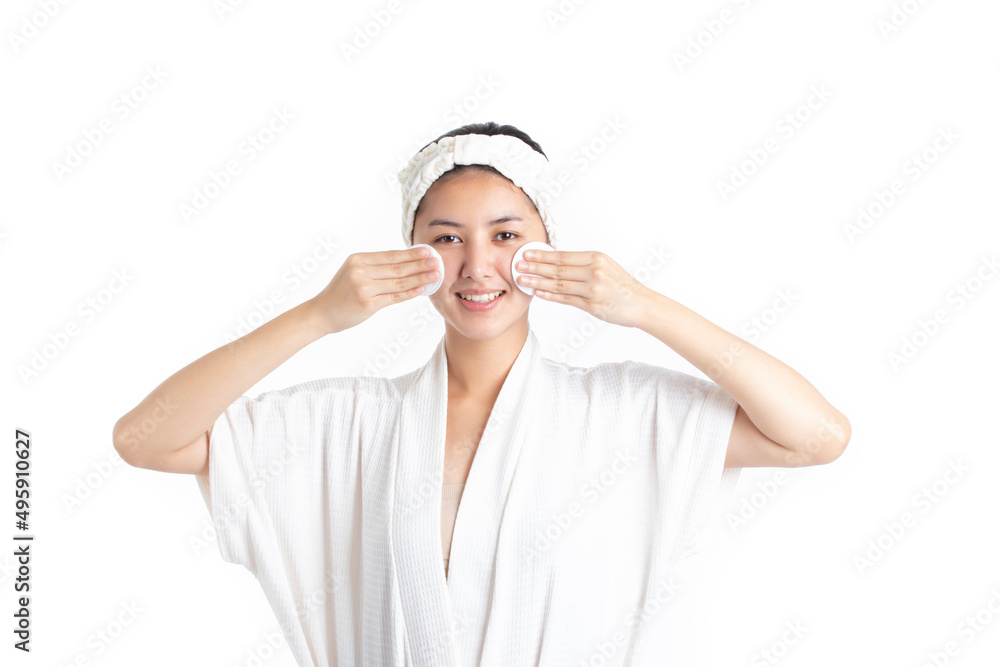 Attractive beautiful natural woman cleaning makeup from her face with cotton pad smile and looking at camera isolated on white background. Skin care and beauty concept. Attractive beautiful natural woman cleaning makeup from her face with cotton pad smile and looking at camera isolated on white background. Skin care and beauty concept.