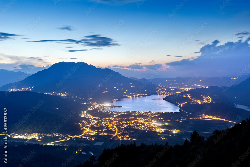 Twilight on the Caldonazzo lake and on the Vigolana plateau. Valsugana, Trento province, Trentino Alto-Adige, Italy, Europe.