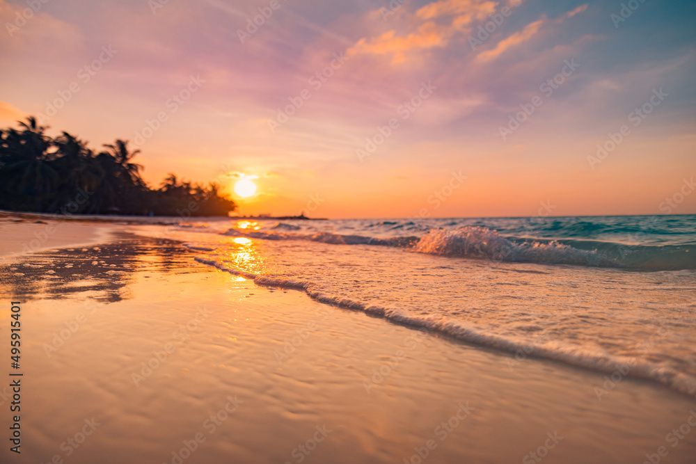 Sunset dramatic sky on sea, tropical desert beach. Dreamy fantasy beach, waves splashing. Warm sunlight peaceful, relaxing paradise island landscape. Exotic nature closeup. Beautiful beachside sunrise
