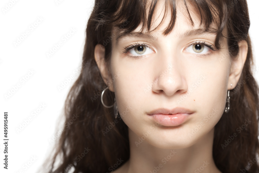Beautiful young girl studio portrait. Looking at camera. Beautiful young girl studio portrait. Looking at camera.