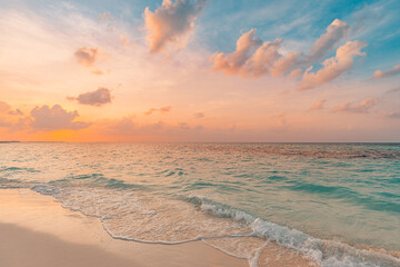 Closeup sea sand beach. Panoramic beach landscape. Inspire tropical beach seascape horizon. Orange and golden sunset sky calmness tranquil relaxing sunlight summer mood. Vacation travel holiday banner