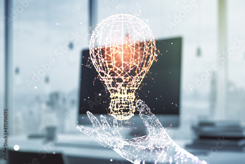 Double exposure of creative light bulb hologram on laptop background, research and development concept © Pixels Hunter