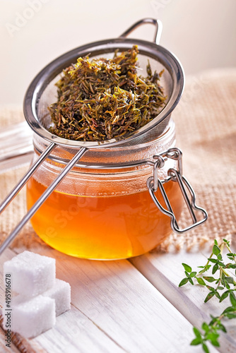 homemade thyme cough syrup in a jar