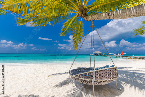Tropical beach paradise as summer landscape with beach swing or hammock and white sand, calm sea for serene beach. Luxury beach scene vacation summer holiday. Exotic island nature travel destination 