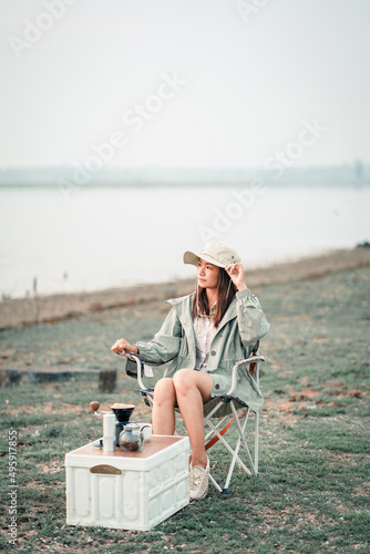 Happy woman relaxing in the holiday morning, traveling and slow life, resting style, camping. selective and soft focus.