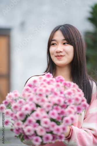young Asian cute girl weari...