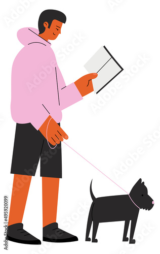 Mna walking with dog and reading book. Literature lover