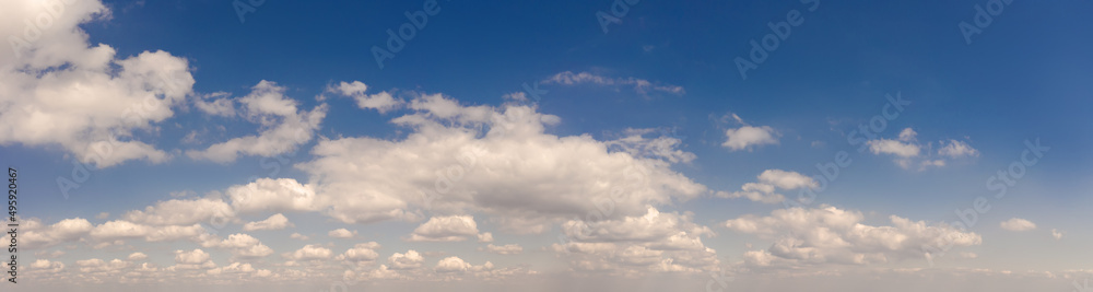 vibrant and saturated blue sky with beautiful clouds vibrant and saturated blue sky with beautiful clouds