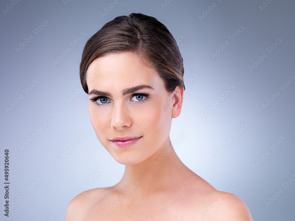 Healthy skin allows you to face the world with confidence. Studio shot of a beautiful young woman posing against a grey background. Healthy skin allows you to face the world with confidence. Studio shot of a beautiful young woman posing against a grey background.