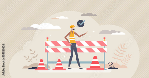 Construction safety and personal protection equipment tiny person concept. Road repair site risk prevention with striped lines, helmet and vest with safe work place rule management vector illustration
