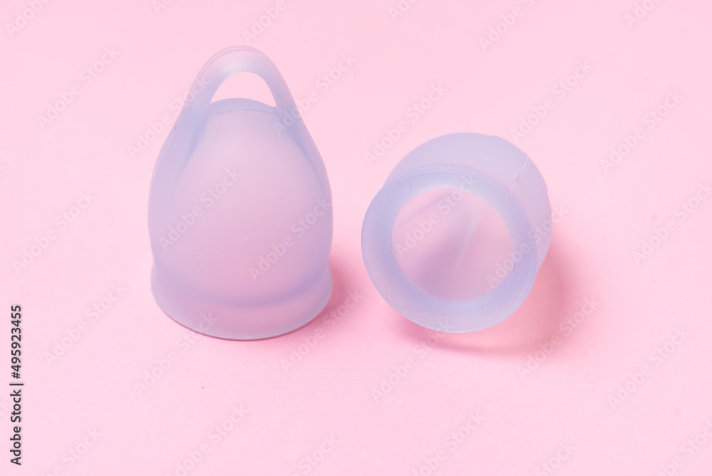 Two Blue Menstrual Cup on Pastel Pink Background Horizontal Copy Space Close Up