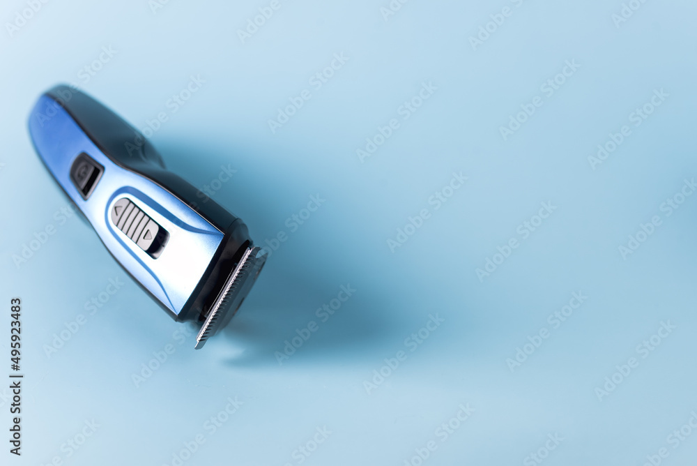 Modern Battery Electric Shaver for Man on Blue Background with Clipping Path Horizontal Copy Space Modern Battery Electric Shaver for Man on Blue Background with Clipping Path Horizontal Copy Space