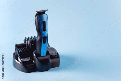 Modern Battery Electric Shaver for Man on Blue Background with Clipping Path Horizontal Copy Space